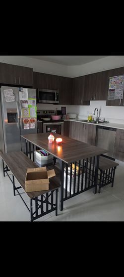 Kitchen table with 2 benches.