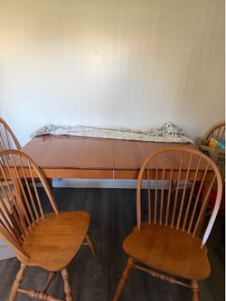 Wood table for sale. Two leaf inserts and 6 chairs