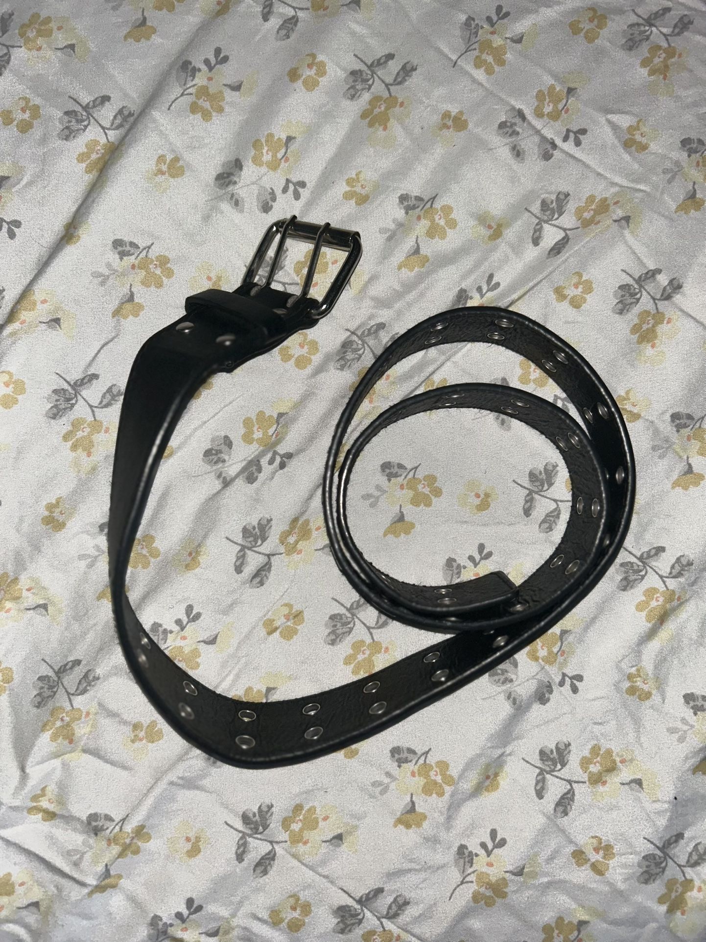 Black leather belt with silver buckle