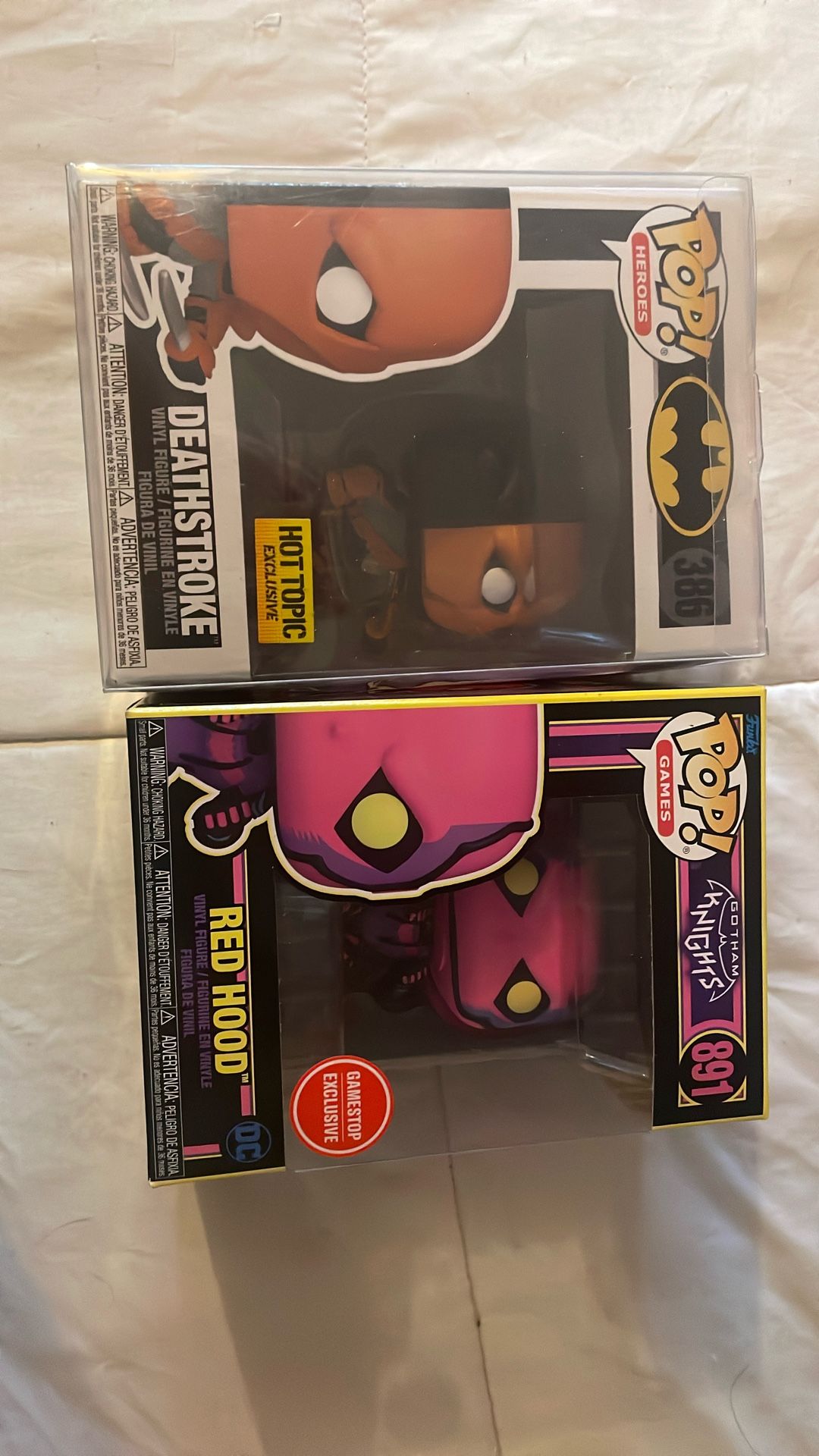 Deathstroke Funko pop and red Hood Funko Pop