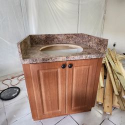 BATHROOM VANITY 28 3/4 WIDE  WITH SINK AND FAUCET