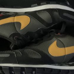 Nike Air Waffle Trainer sneakers in a Cargo Khaki/Gold/Black/Camo colorway. 