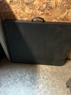 Black cosco folding table and six chairs
