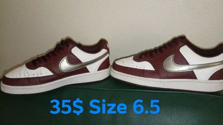 Nike Court Vision Low sneakers in a white, burgundy crush, and metallic pewter colorway.