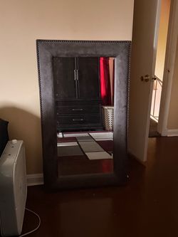 large floor-standing or wall-mountable accent mirror