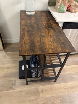 Wood and black metal bar with stools