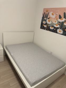 Full bed with mattress and nightstand
