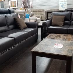Dark brown faux leather pinhead sofa love with accent pillows