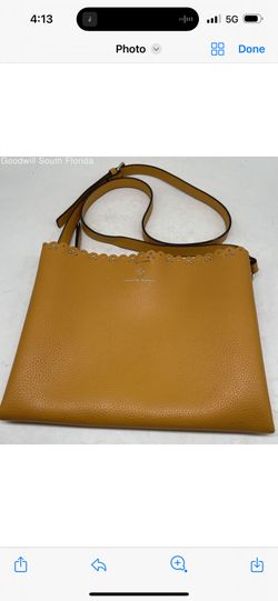 Elevate your style with this Nanette Lepore mustard yellow crossbody bag. Featuring an elegant scalloped edge design adorned with subtle metallic deta