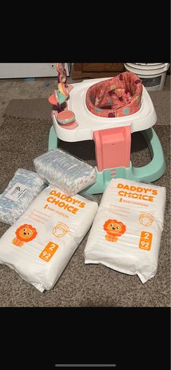 A bicycle for children, comes with 4 packs of diapers.