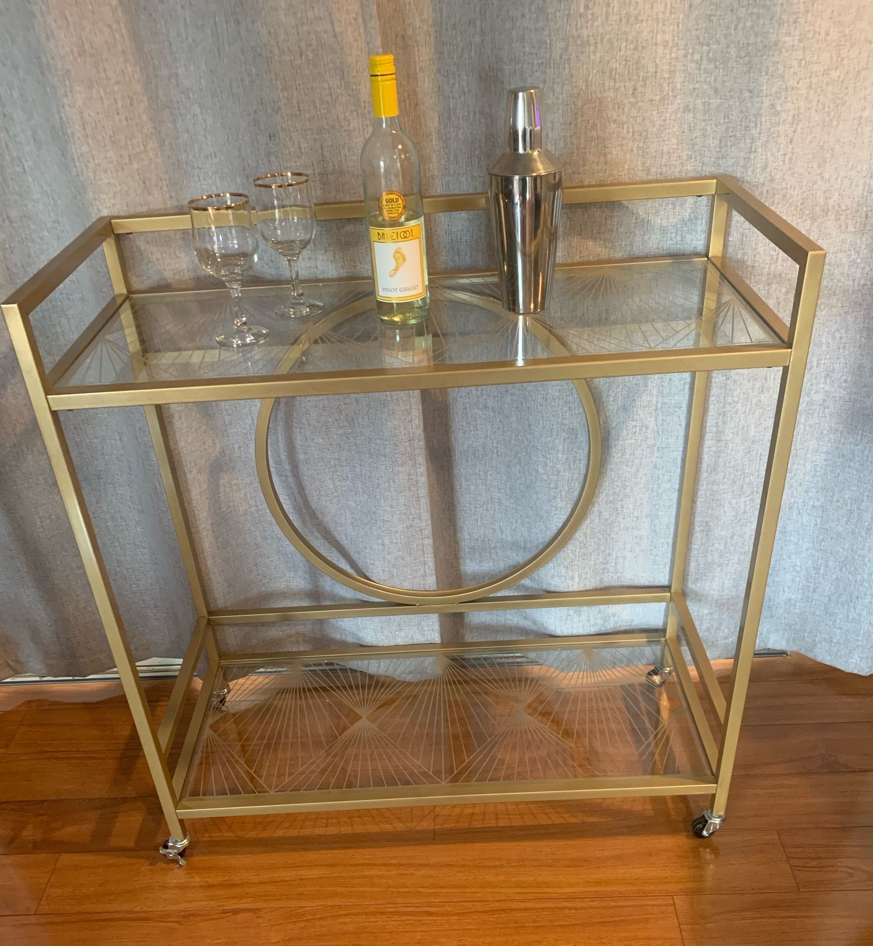 GOLD METAL ROLLING BAR CART WITH TWO ETCHED GLASS SHELVES
