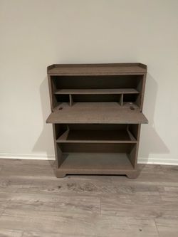 Older fashioned bookcase & desk.