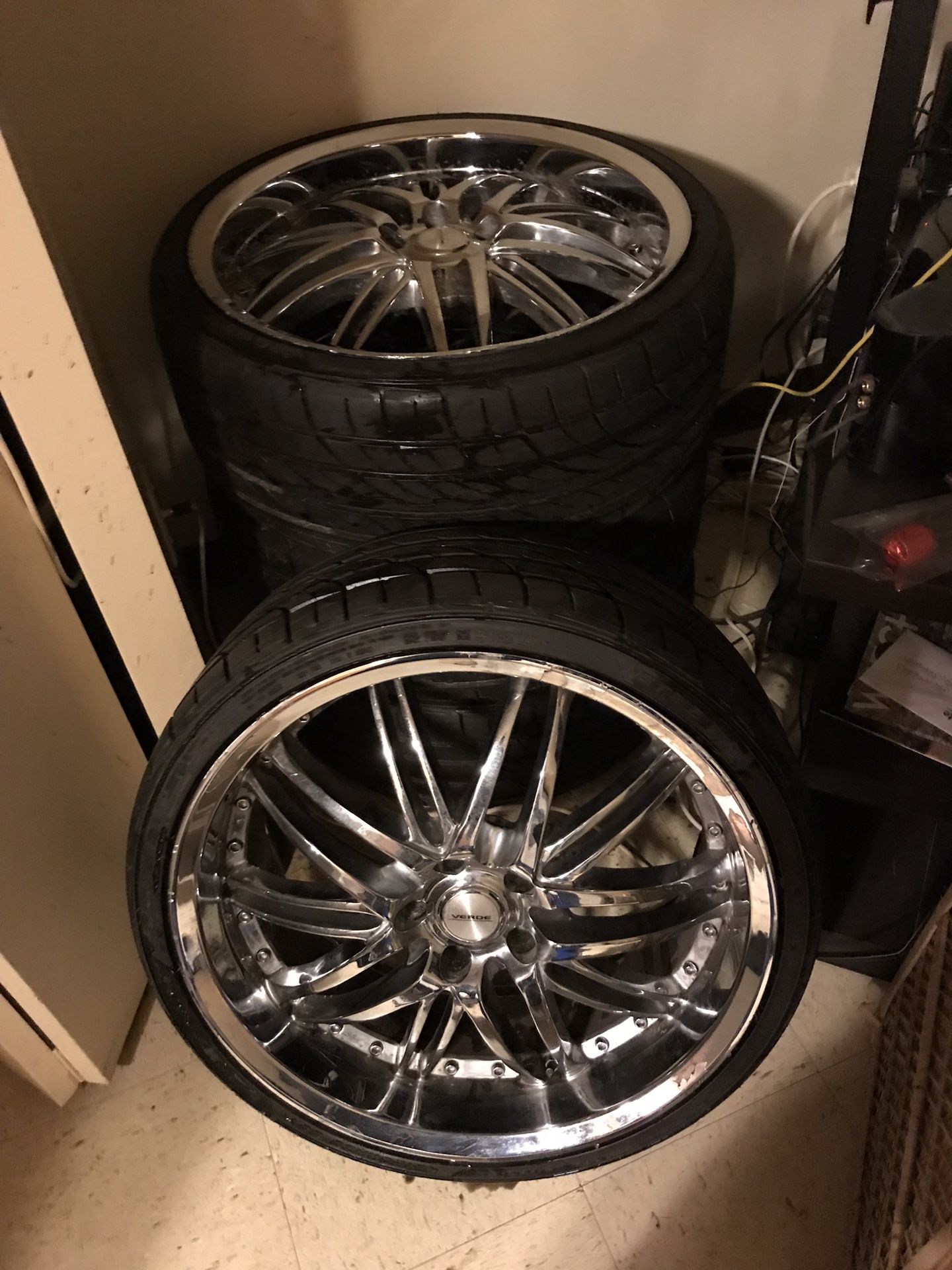 4 used 20 inch verde chrome rims and 4 used low profile tires