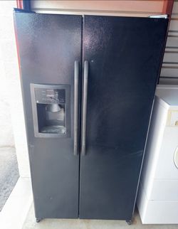 Black GE Refrigerator And Freezer
