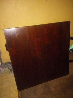 WOODEN TABLE WITH PROTECTIVE GLASS TOP MEASURES 42 INCH X 42 INCH EXCELLENT CONDITION 