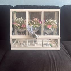 Vintage-Style Glass Display Case with Floral Arrangements