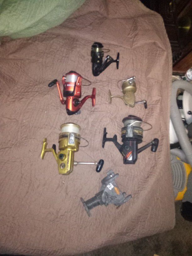 5 Fishing Reels And Pole Holder $50