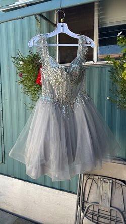 Dama dress from dancing queen color is silver size is a small