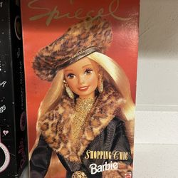 1995 Limited Edition Spiegel Shopping Chic Barbie doll.  The doll was a store exclusive for Spiegel. It features blonde hair and is wearing a black an