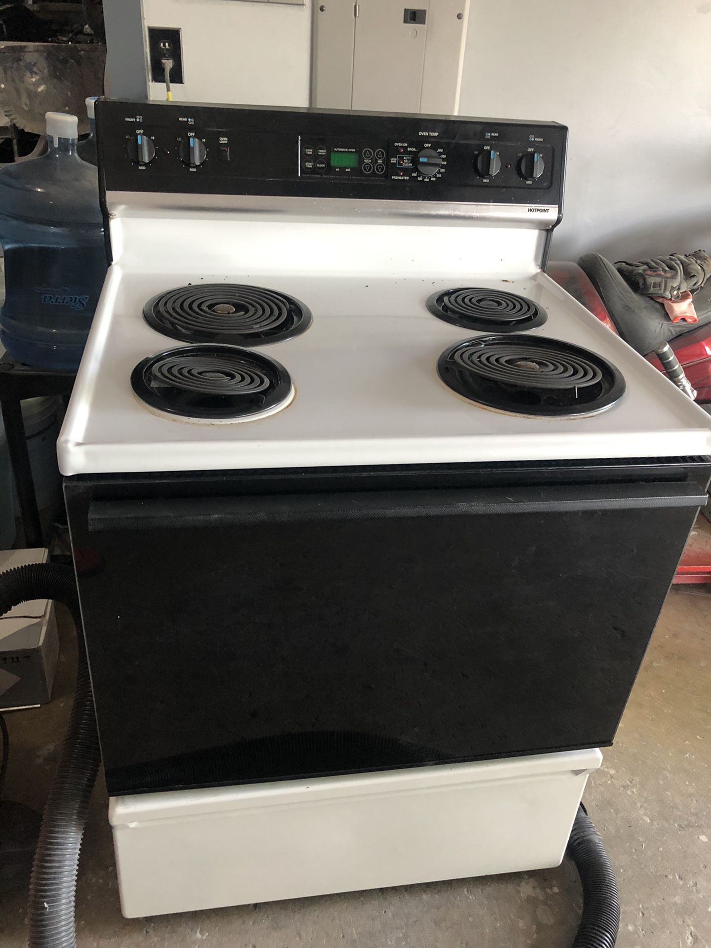Hotpoint Electric Stove & Whirlpool Microwave Oven