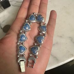 925 Sterling Silver Hearts Bracelet with genuine lapis stones , will fit 7.75- 8 in. Adjustable closure, sterling beads and moon end caps . Beautifull