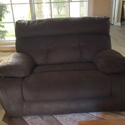 Brown fabric couch and loveseat