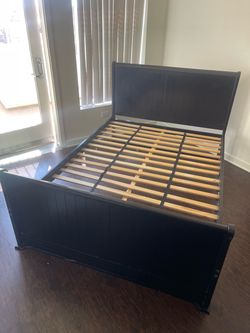 Dark brown wooden bed frame