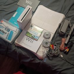 Nintendo Wii With Fit Board, Gun And Cords. Needs Controller. 60$ 