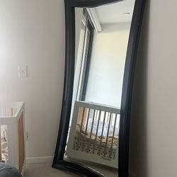 Large black framed mirror