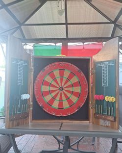 Vintage DART board with 12 darts.