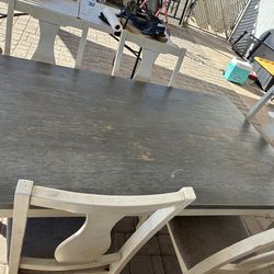 Kitchen table with 5 chairs . (Grey and white )