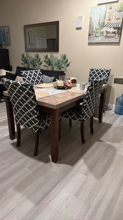 Marble tabletop, 4 chairs and a bench.