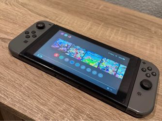 Nintendo Switch with 8 games and two controllers