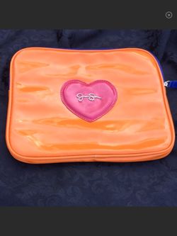 Jessica Simpson iPad holder holds Air also