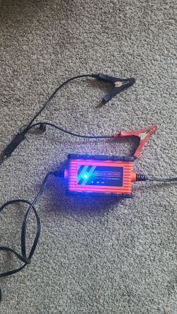 Black+Decker BC2WBD, a fully automatic 2-amp, 12V automotive battery charger and maintainer with a waterproof housing.