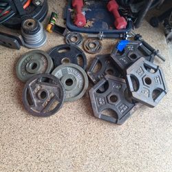 350 lbs of Olympic plates And 4*50 Lb Dumbbells 