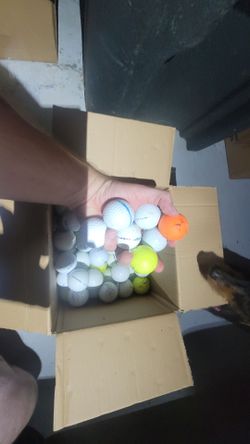 Assorted used golf balls. Random names and conditions.