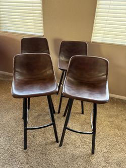 Brown leather bar stools