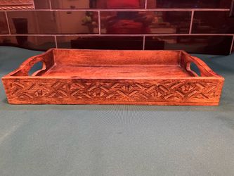 Beautiful hand carved wooden serving tray with decorative sides and handles