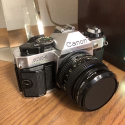 Camera 📷 Canon, AE-1 with canon lens as in picture.  In excellent, perfect condition👍🏻