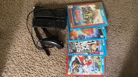 Two Wii remotes (generic), 1 nunchuck, and 4 Wii U games