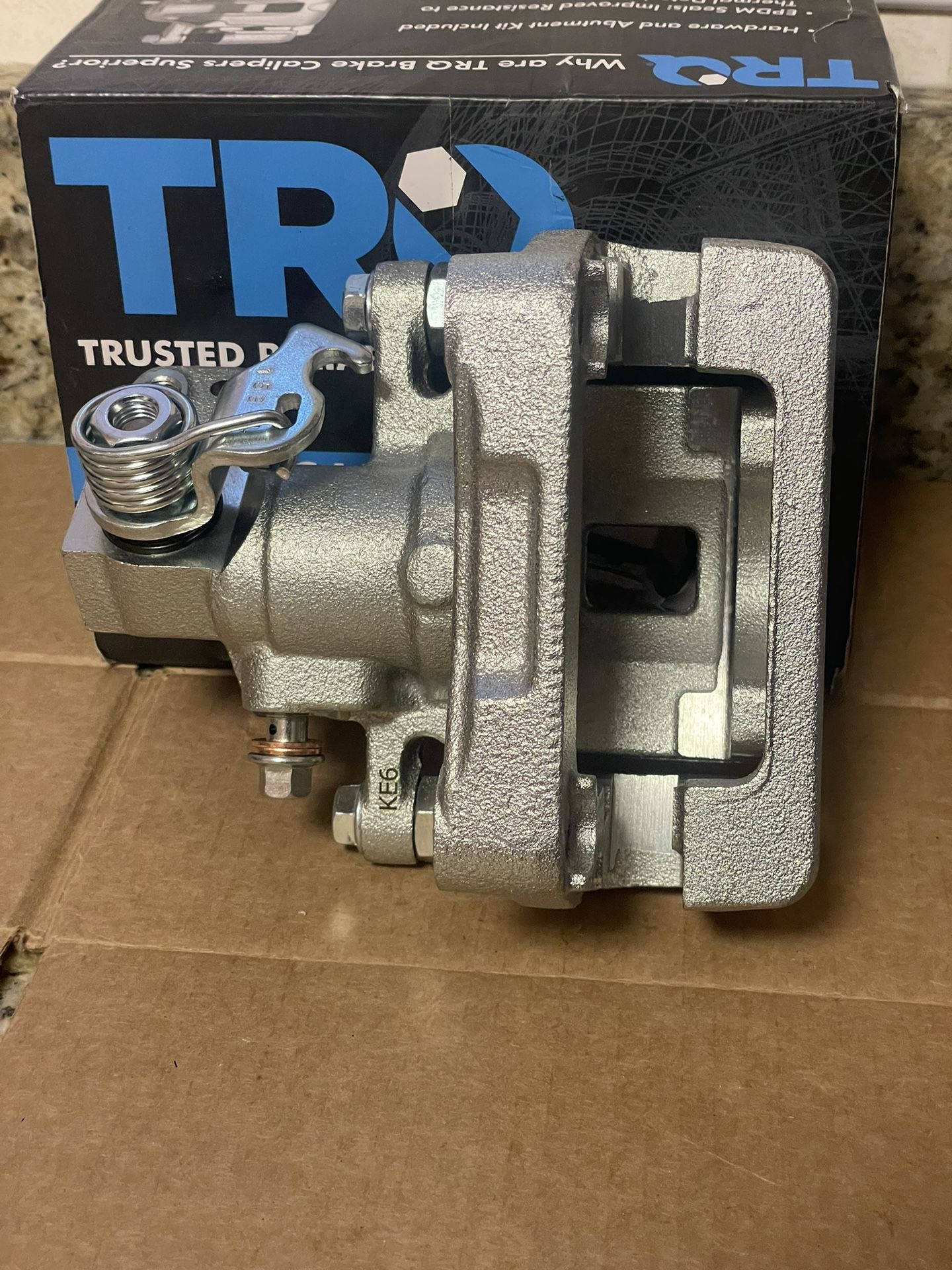 Caliper w/braket driver side(Mazda) (see pics & description).