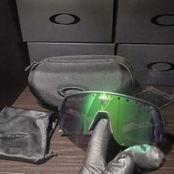 Green reflective Oakley sun glasses
