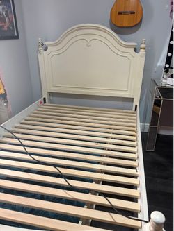 Full size bed with twin size trundle underneath