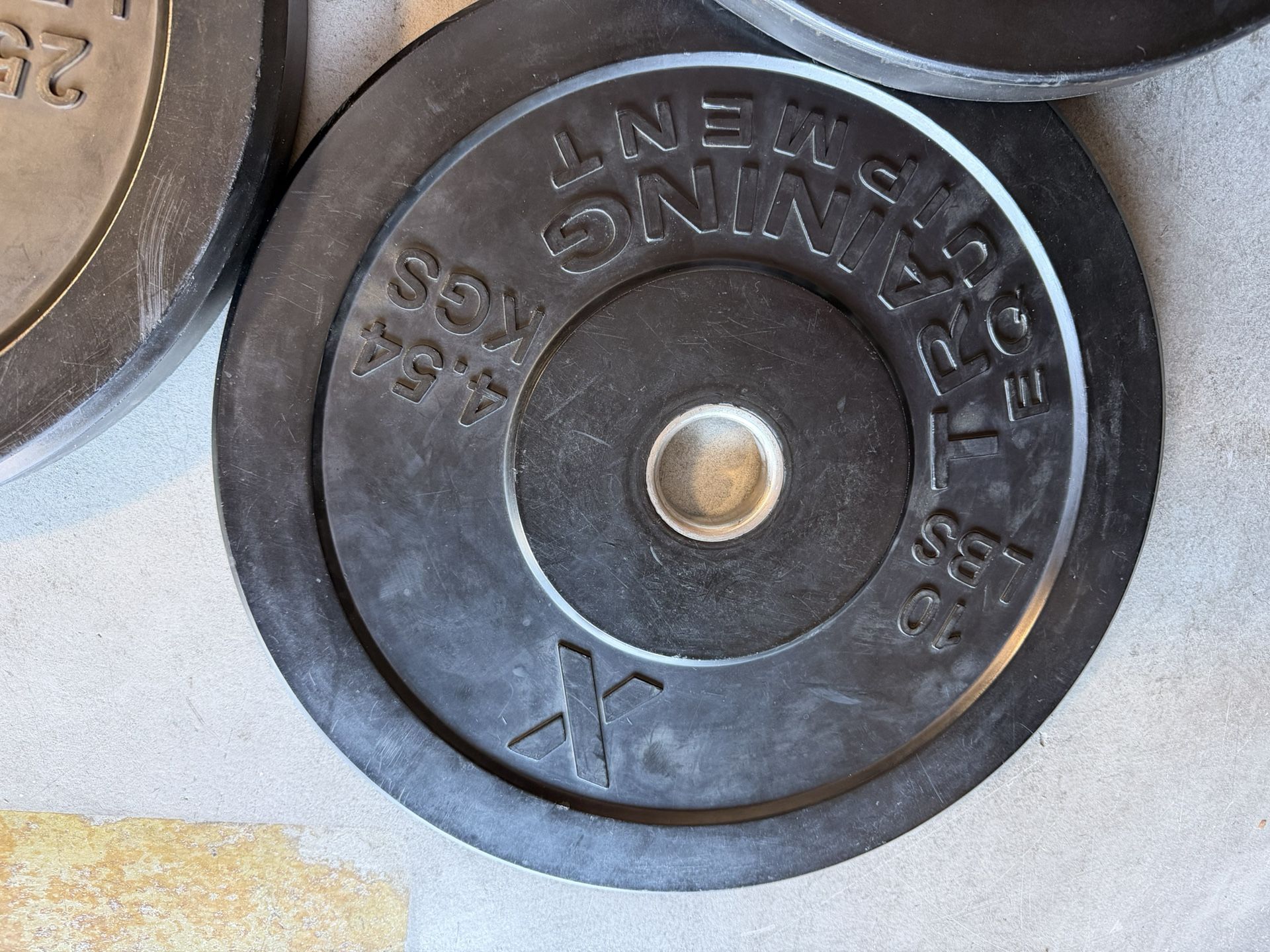 Rubber Barbell Plates - $1 Per Pound