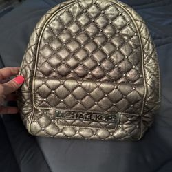 Michael Kors metallic gunmetal gray quilted leather backpack. 