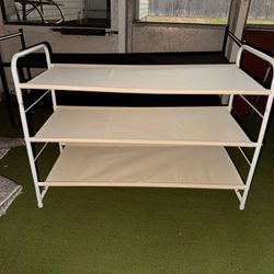 White metal frame with fabric shelves. Shoe rack
$20