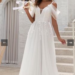 Wedding dress size 6 us corsett adjustable (Used For Photoshoot)