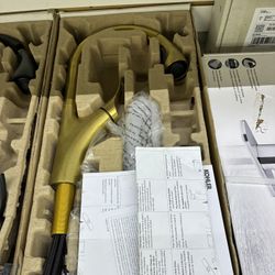 Kohler Graze kitchen faucet features a brushed gold finish