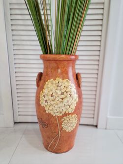 Traditional decorative glazed earthenware amphora with textured finishes. Includes ornamental horsetail stems.